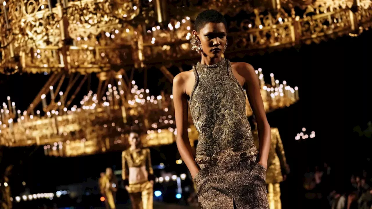Saint Laurent dazzles with a river of gold, a black runway and an Eiffel Tower backdrop at Paris Fashion Week