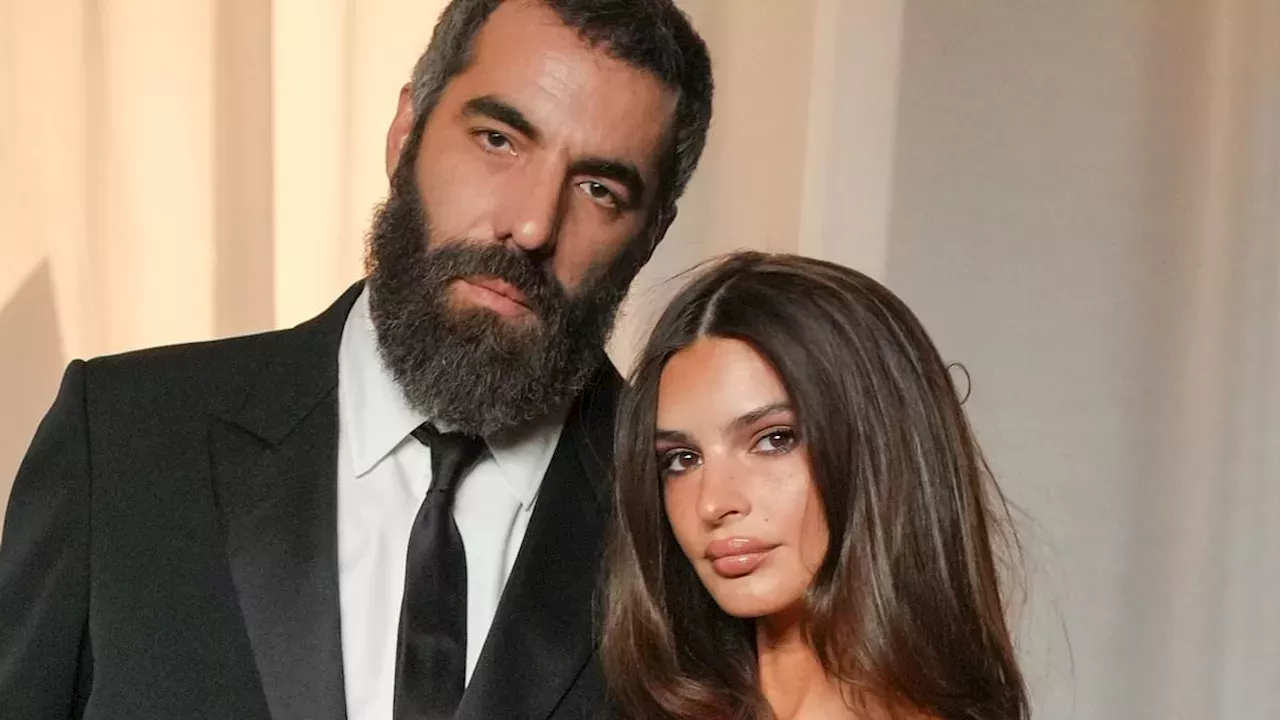 Emily Ratajkowski glows in red as she cosies up to boyfriend Romain Gavras at the Academy Museum Gala in LA