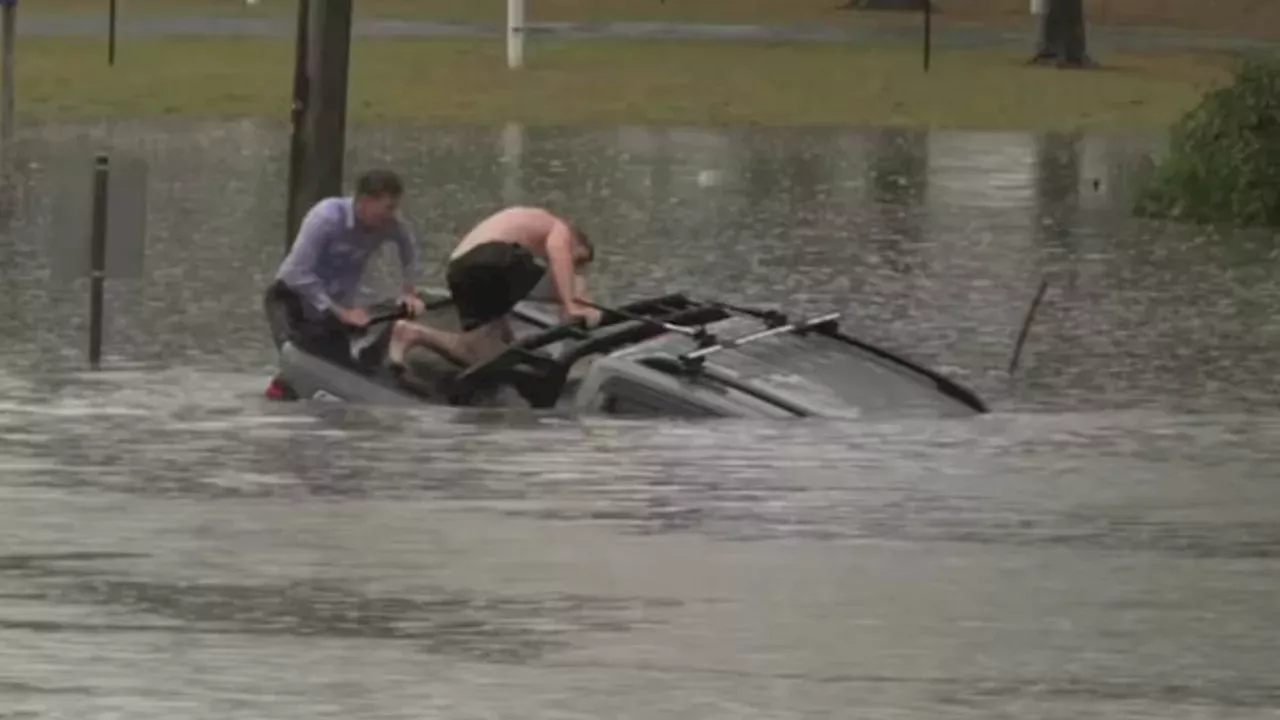 Seconds from Submersion: ABC Reporter's Daring Rescue in Queensland Floods