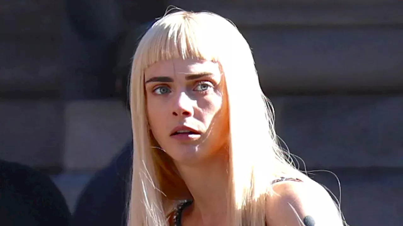 Cara Delevingne ditches brunette locks for platinum blonde wig as she poses in Swarovski gown on New York street